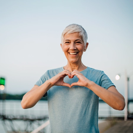 Chiropractic Erie CO Lady Making Heart Hands